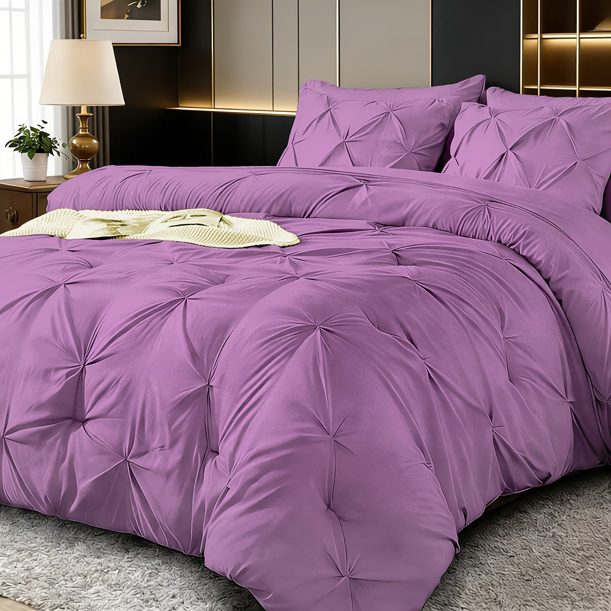 Purple textured comforter set on a bed in a bedroom setting.