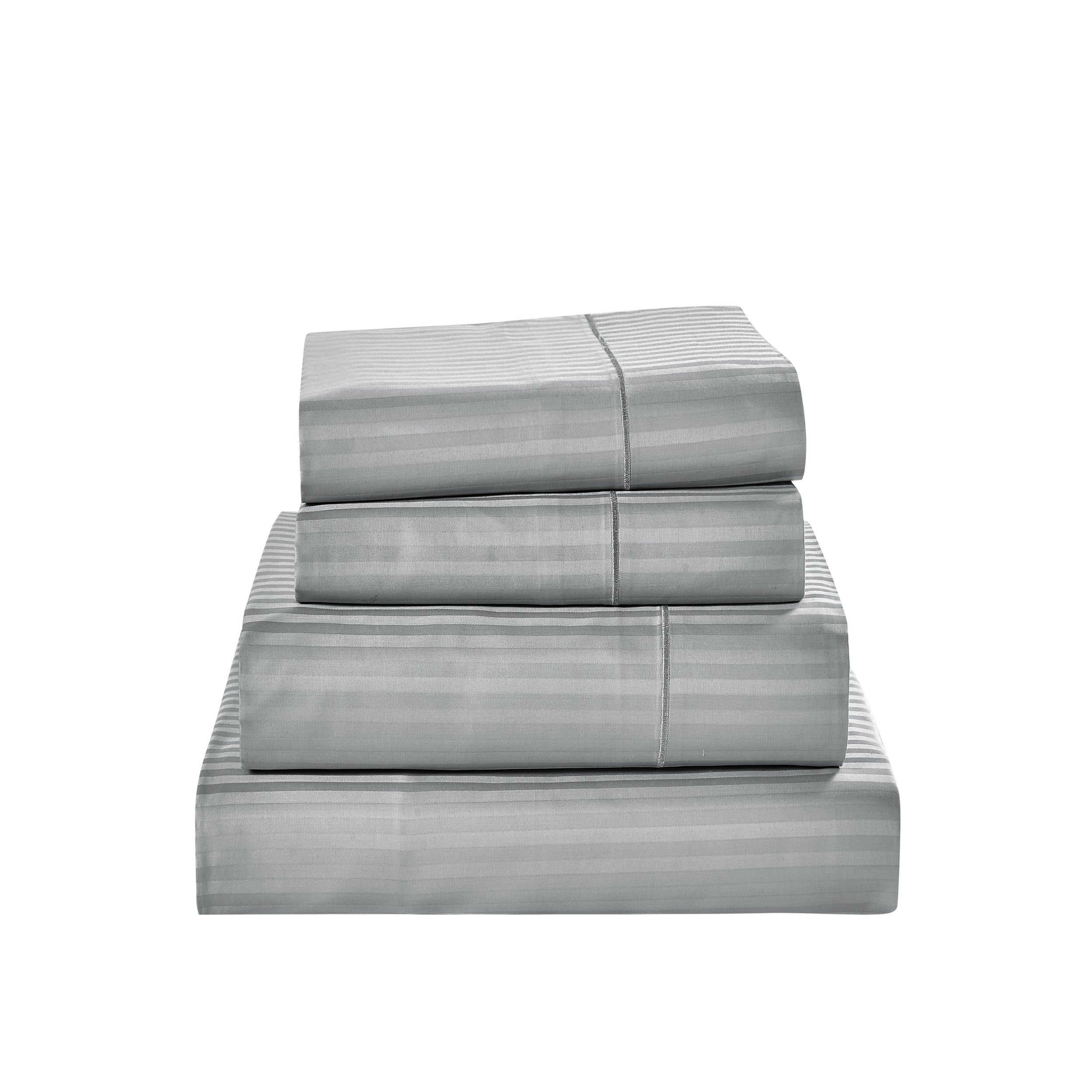 Gray striped bed sheet set on a white background