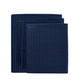 Set of navy blue bed sheets and pillowcases on a white background