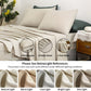 Beige bedding set with two pillowcases, a fitted sheet, and a flat sheet on a bed. Light references are shown below.