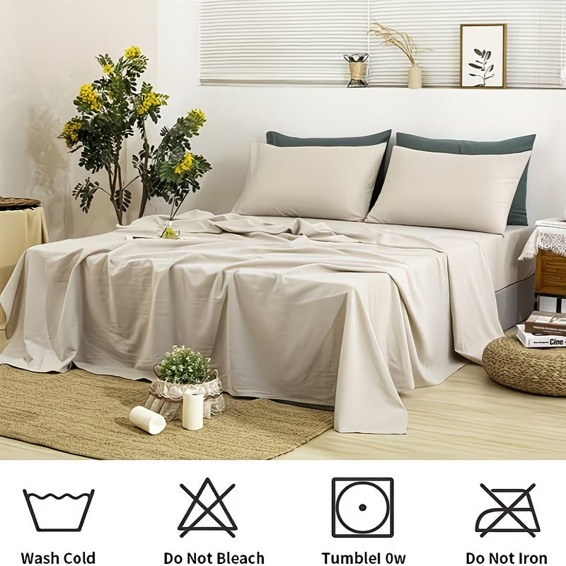Neatly made bed with beige bedding and gray pillows in a bedroom setting.