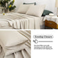 Beige linen bedding set with pillows and a nightstand in a bedroom setting, highlighting the envelop closure feature.