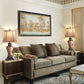Living room with a beige sofa, two lamps, and a painting on the wall.