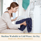 Woman holding a blue towel next to a washing machine with text about machine washable towels.