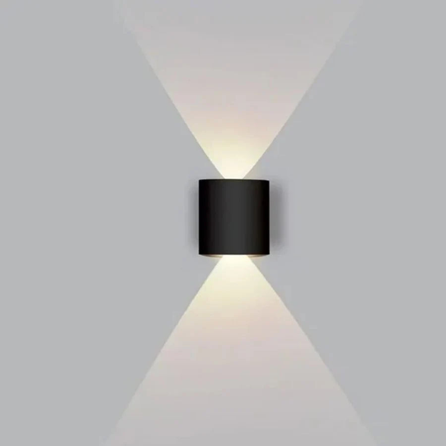 Modern wall-mounted light fixture on a gray background