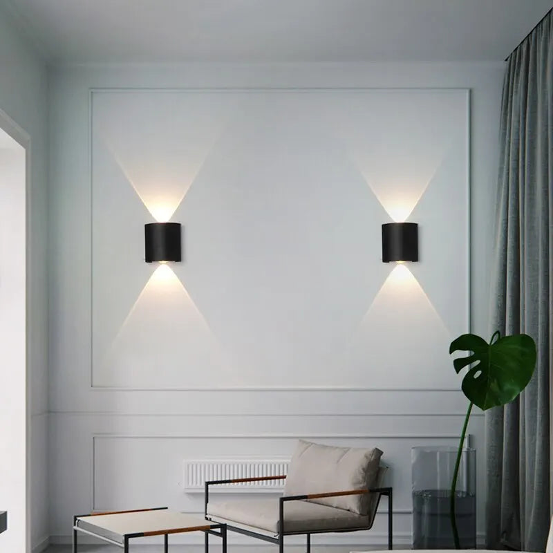 Modern wall lights on a white wall with a minimalistic interior design.