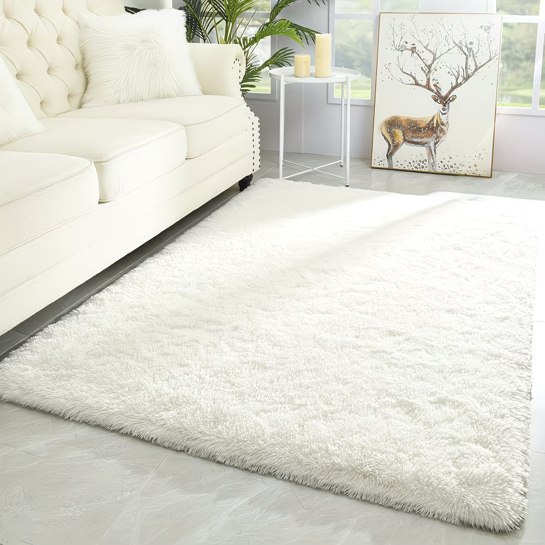 White shaggy rug in a living room with a white sofa and decorative elements.