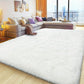 White fluffy rug in a living room with a sectional sofa and city view.