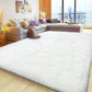 White fluffy rug in a living room with a sectional sofa and city view.