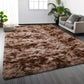 Brown shaggy rug in a living room setting with a sofa and plants.