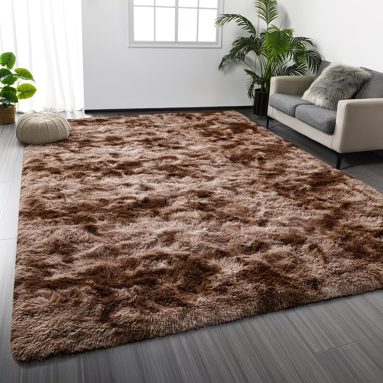 Brown shaggy rug in a living room setting with a sofa and plants.