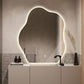 Bathroom with a modern vanity and illuminated mirror