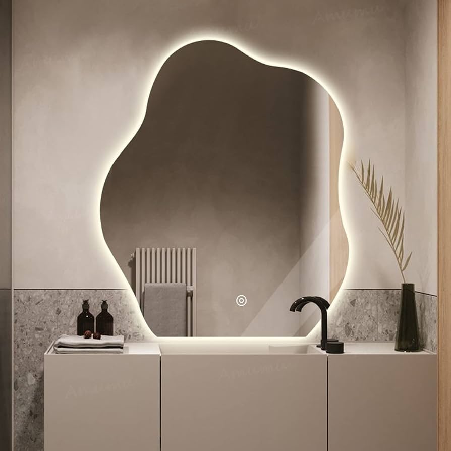 Bathroom with a modern vanity and illuminated mirror
