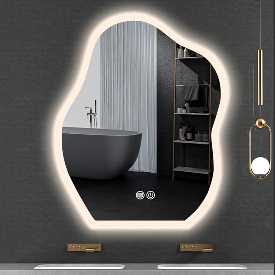 Bathroom with a large illuminated mirror reflecting a bathtub and shelves.