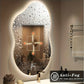 Anti-fog bathroom mirror with water droplets and a control panel in a bathroom setting.