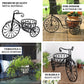 Decorative metal bicycle planter with text highlighting features on a white background