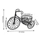 Dimensions of a decorative metal bicycle planter with baskets on a white background