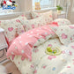 Children's bedroom with cartoon-themed bedding featuring Sanrio characters.