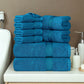 Stack of blue towels on a bathroom counter with neutral background
