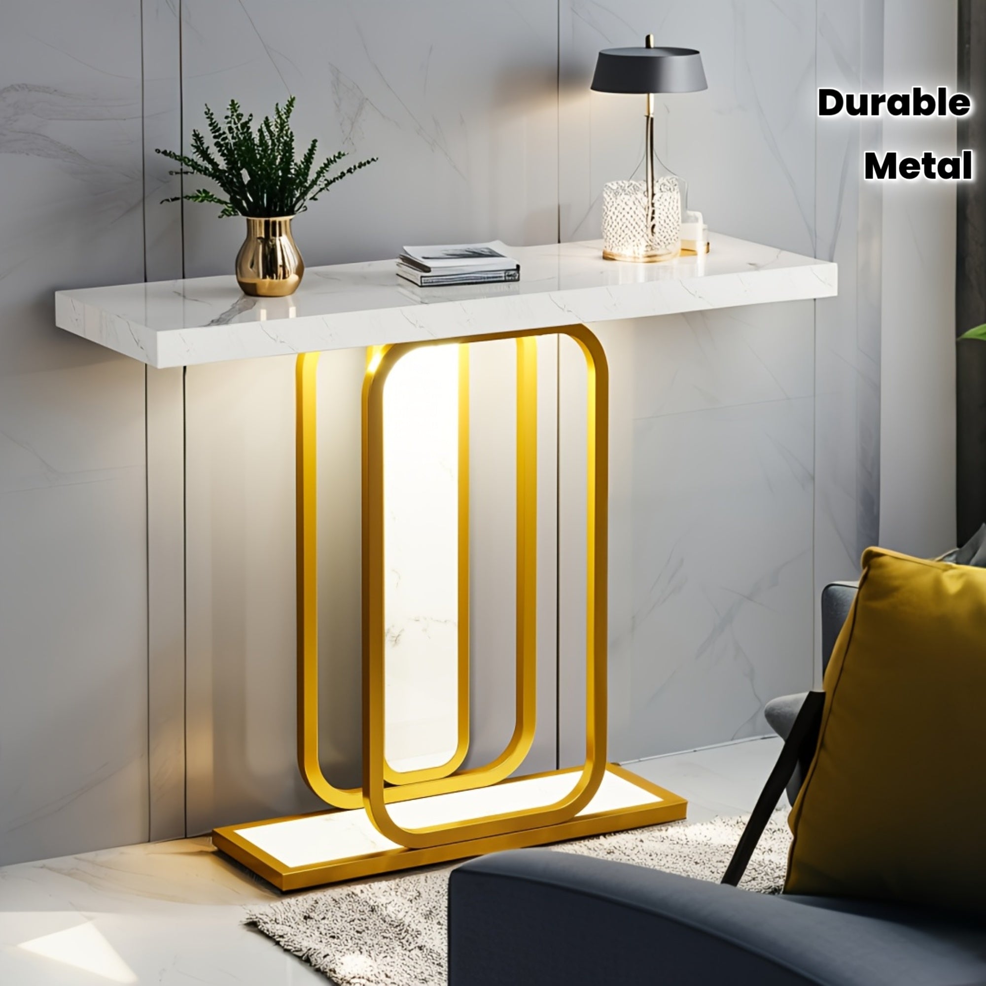 Modern console table with gold legs and white marble top in a living room setting.