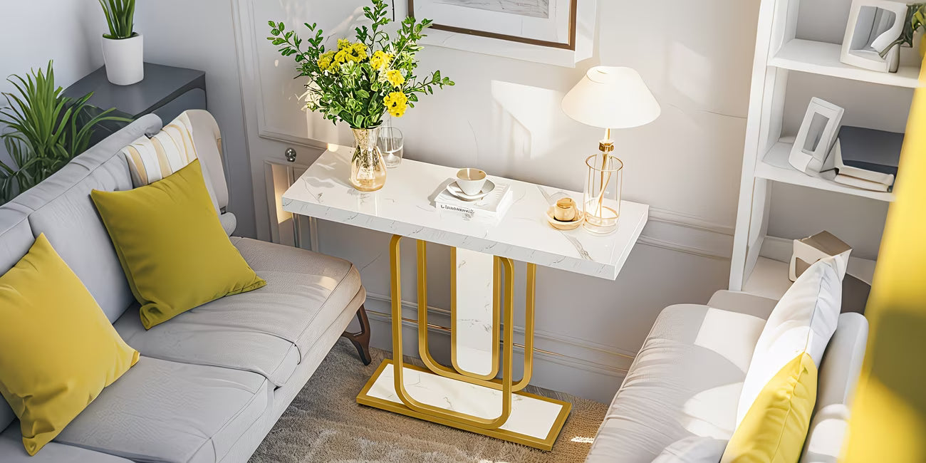 Modern living room with gray sofa, yellow cushions, and a small table with decor items.