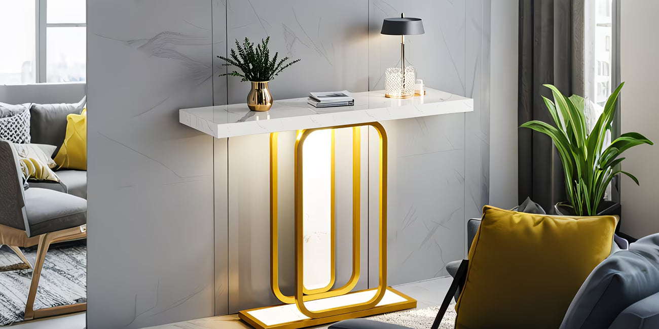 Modern interior design with a console table featuring yellow metal legs, gray sofa, and plants.
