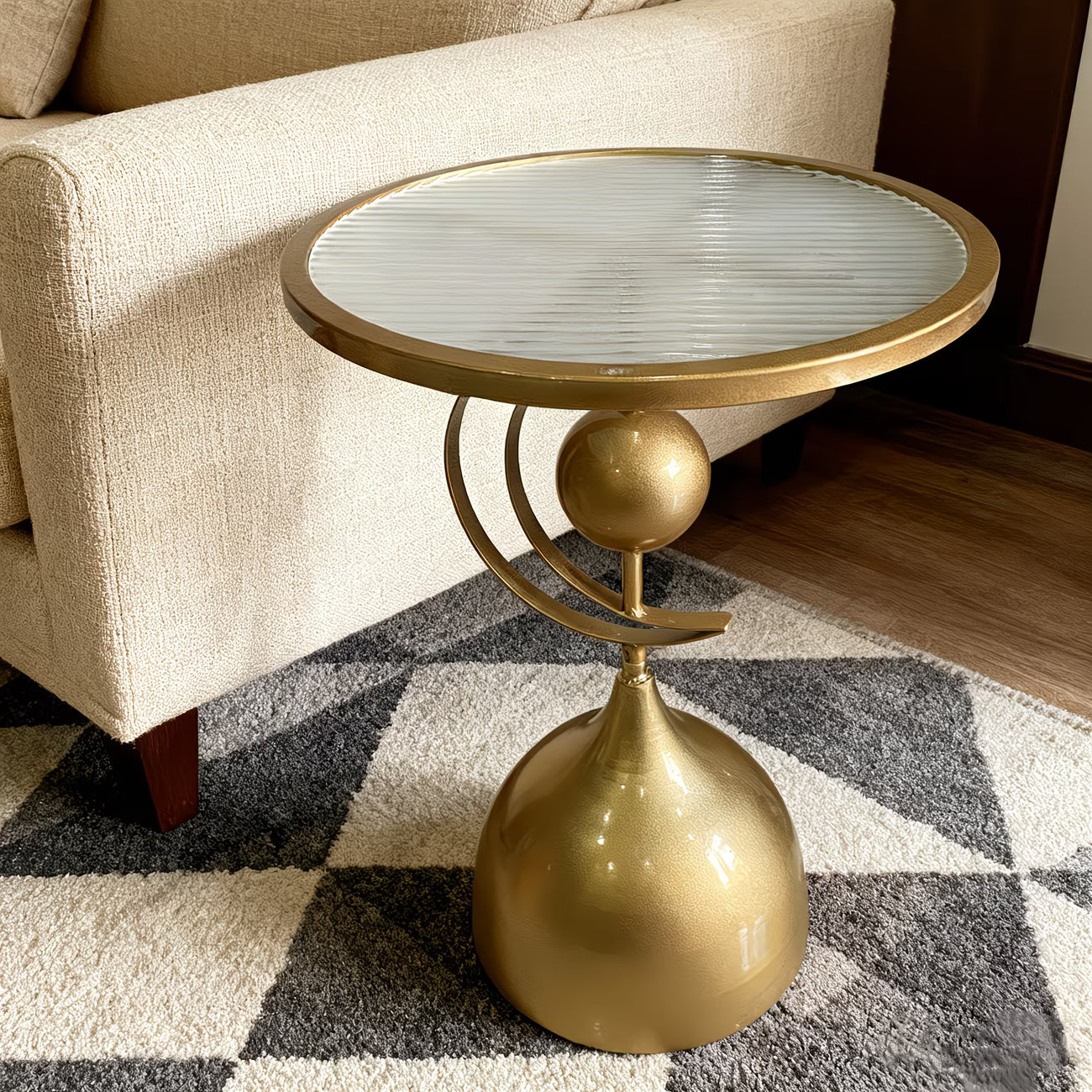 Gold side table with a round mirror top in a living room setting