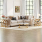 Living room with a beige sofa, coffee table, and decorative items.