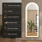 LED lighted mirror with features listed on a black panel, placed indoors.