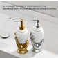 Two decorative soap dispensers, one gold and one silver, on a neutral background.