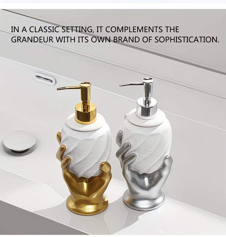 Two decorative soap dispensers, one gold and one silver, on a neutral background.
