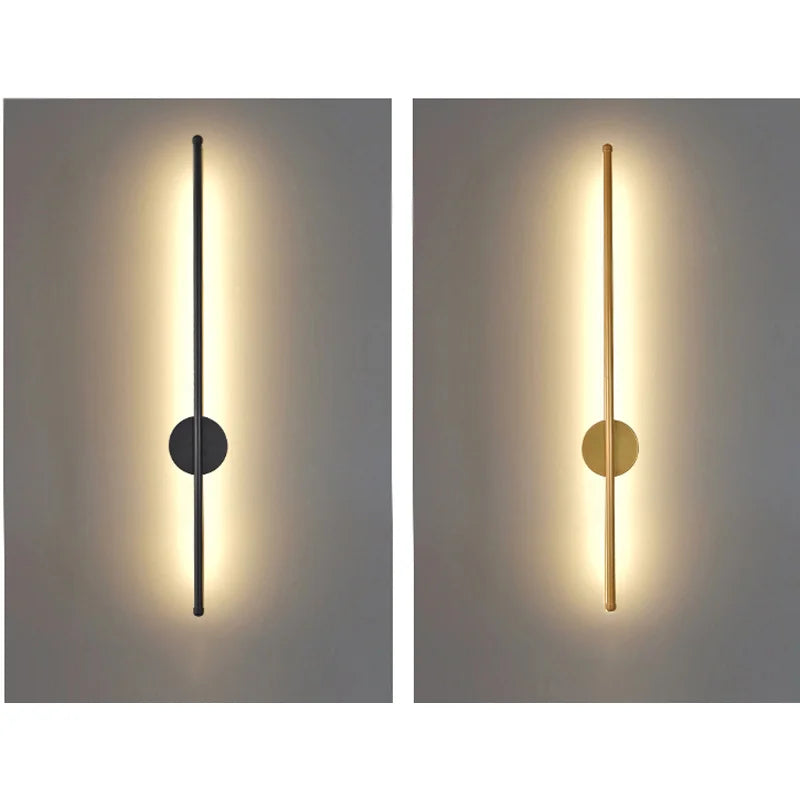 Two wall lights, one black and one gold, on a gray background.