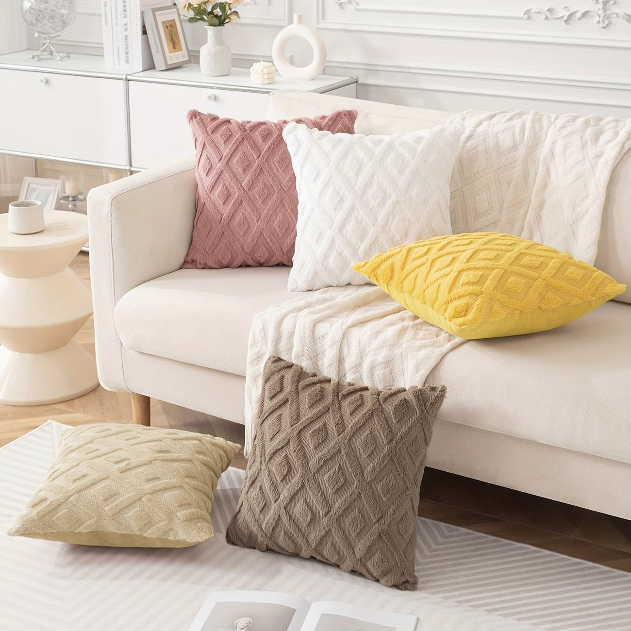 White sofa with patterned cushions in a living room setting