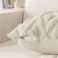 Close-up of a textured beige pillow on a sofa