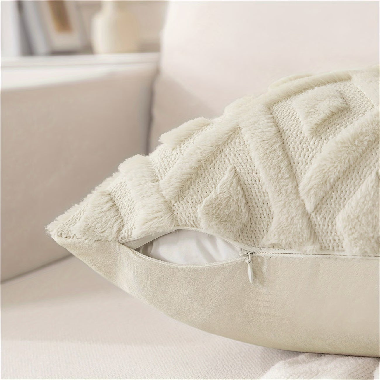 Close-up of a textured beige pillow on a sofa