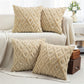 Beige textured throw pillows on a sofa in a living room setting.