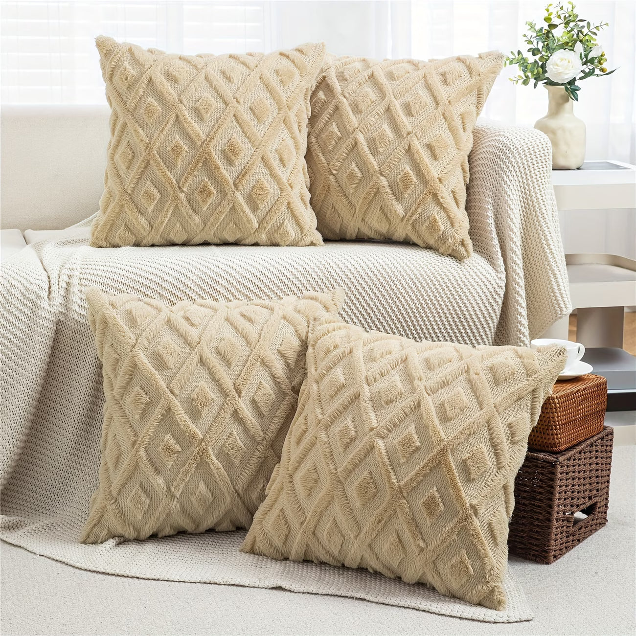 Beige textured throw pillows on a sofa in a living room setting.