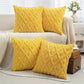Yellow textured pillows on a sofa in a living room setting