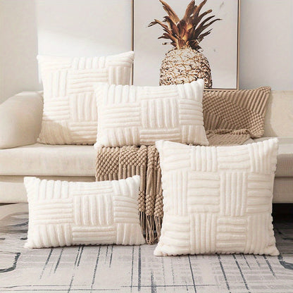 White textured pillows on a couch with a decorative pineapple in the background