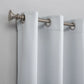 White curtain with silver rings and fixtures on a light gray background
