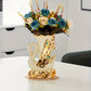 Decorative vase shaped like a swan with flowers on a table