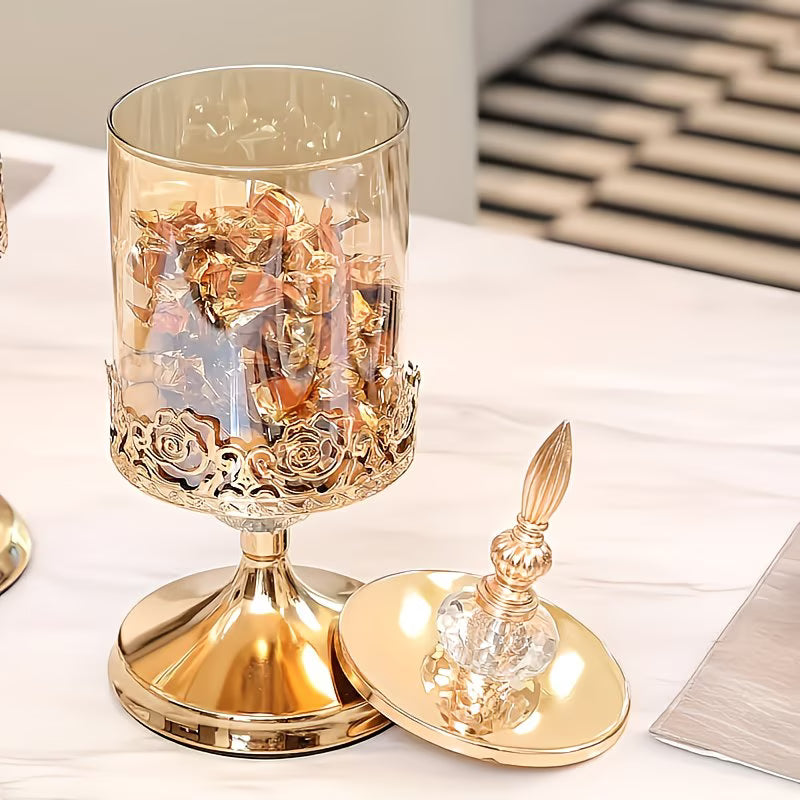 Decorative glassware with gold accents on a white surface