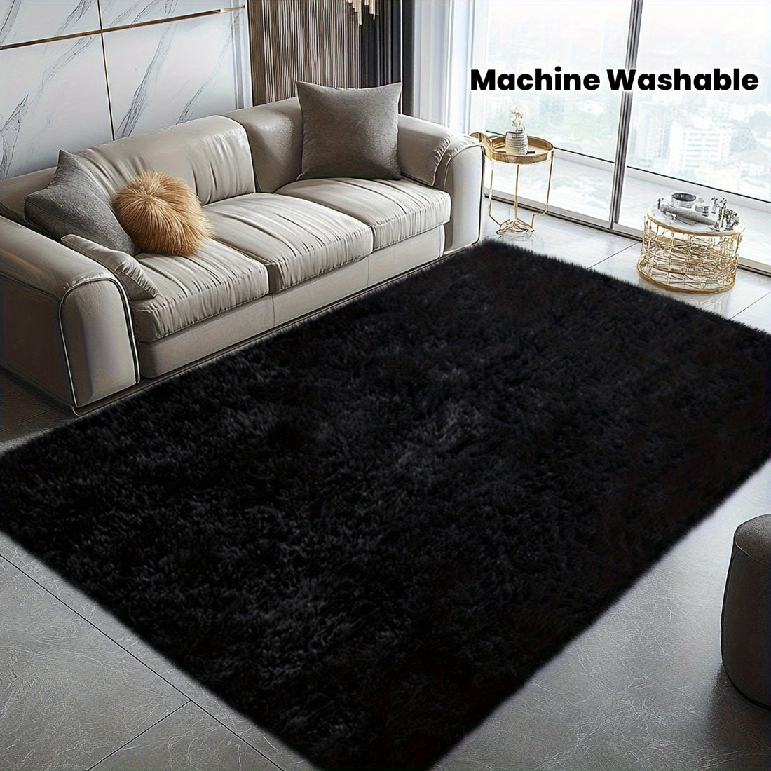 Black rug in front of a gray sofa with 'Machine Washable' text above.