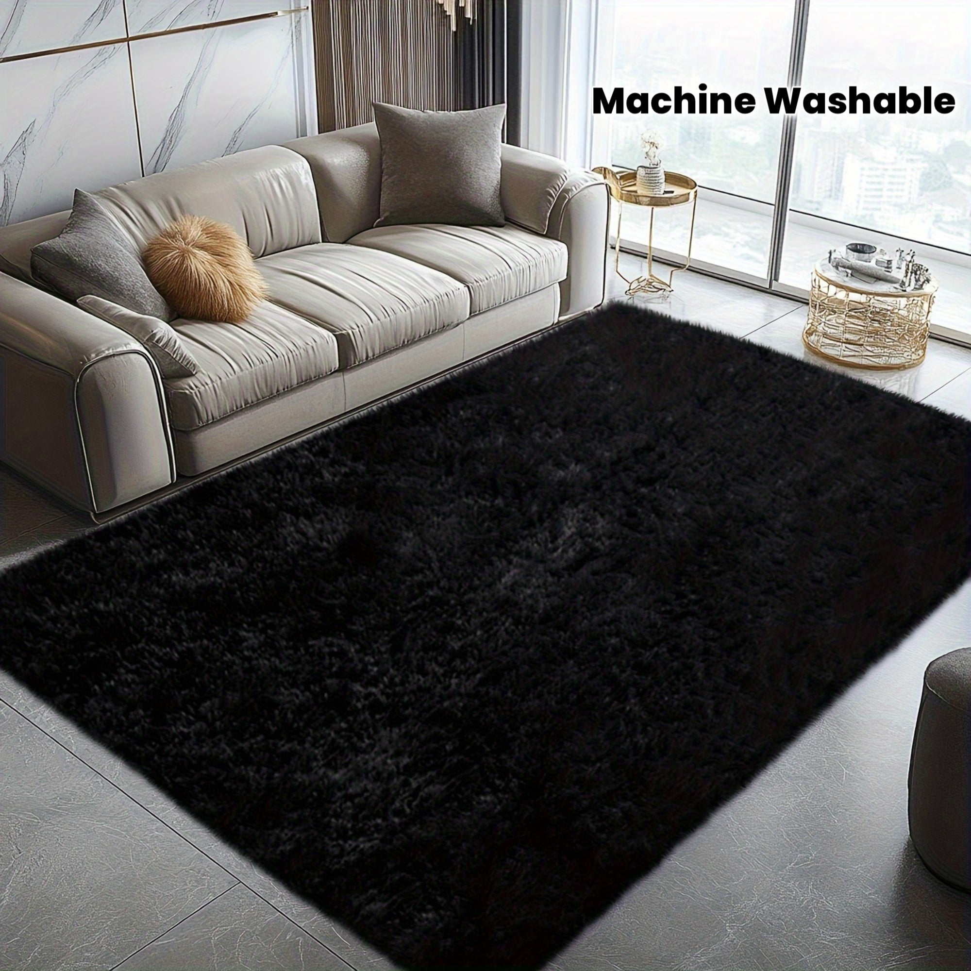 Black rug in front of a gray sofa with 'Machine Washable' text above.