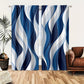 Blue and white wavy patterned curtains in a room with a brown couch and plant.