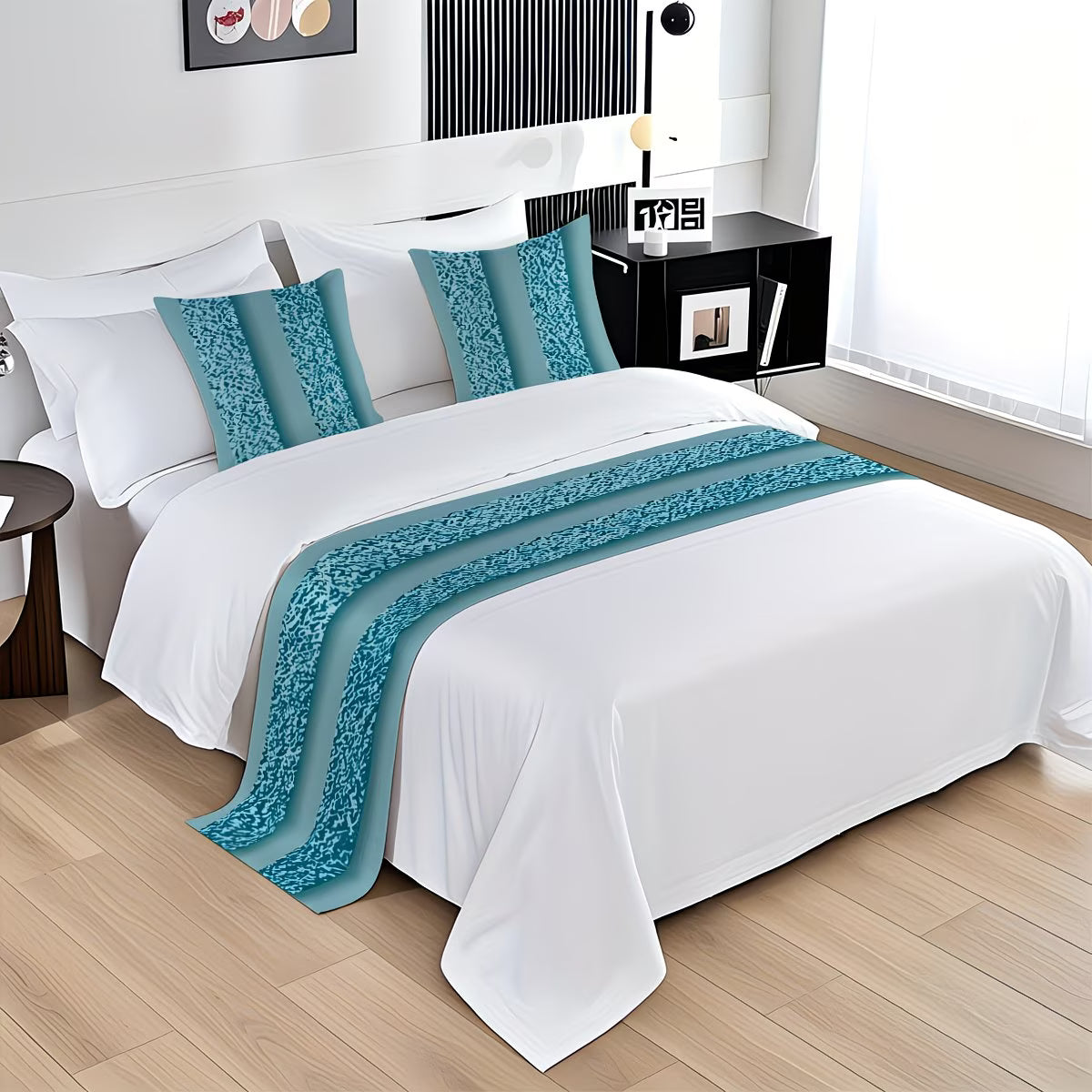Bed with white bedding and blue decorative pillows and runner in a bedroom setting.