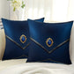 Two blue decorative pillows with gemstones on a white surface.