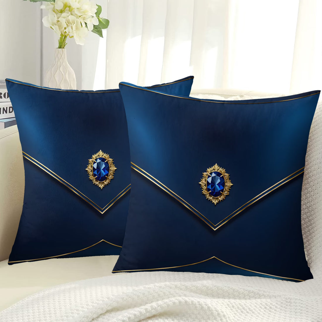 Two blue decorative pillows with gemstones on a white surface.