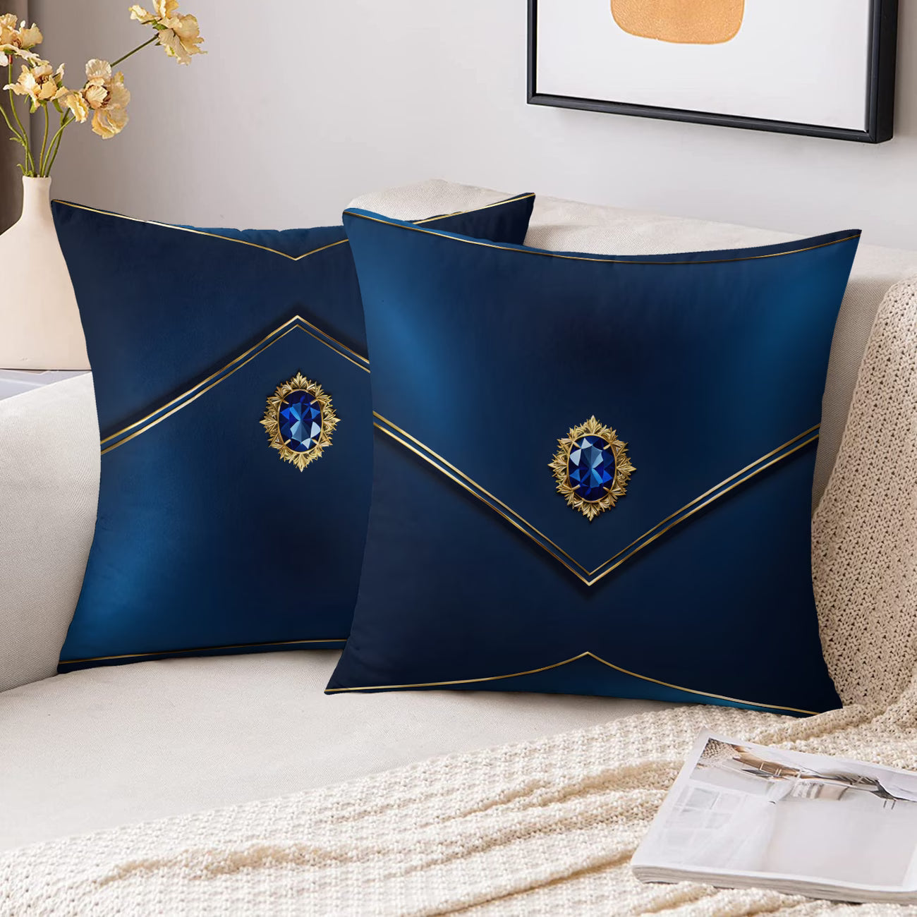 Two decorative blue pillows with gemstones on a couch.