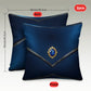 Two blue pillows with a decorative gemstone on a gray background